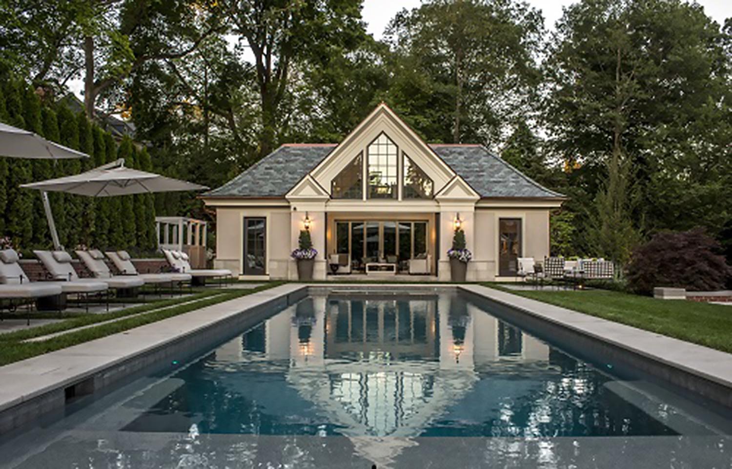 Pool house with elevating TV - West Newton