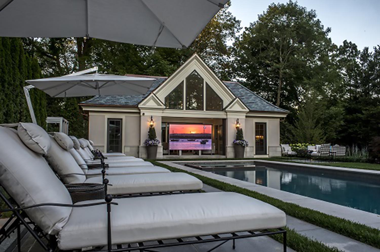 Pool house with elevating TV - West Newton